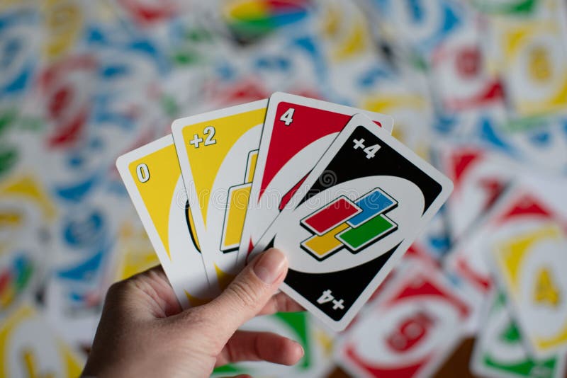 Deck of Uno Game Cards Scattered All Over on a Table. American