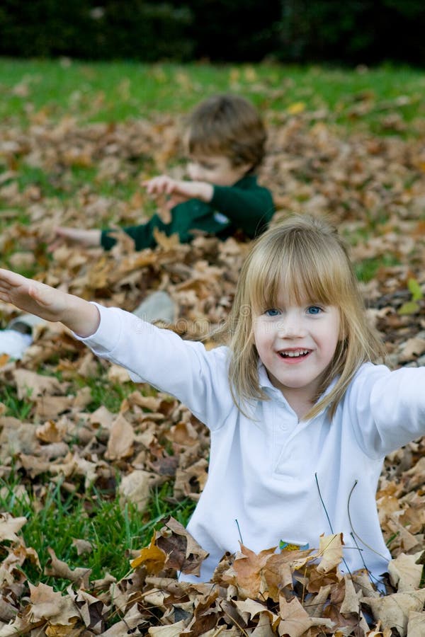 Playing in the autumn leaves