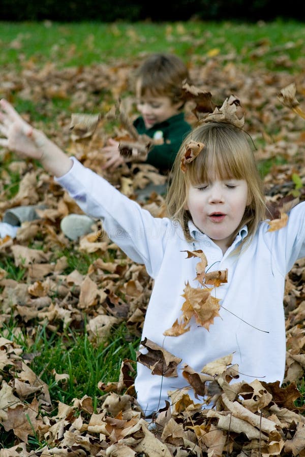 Playing in the autumn leaves