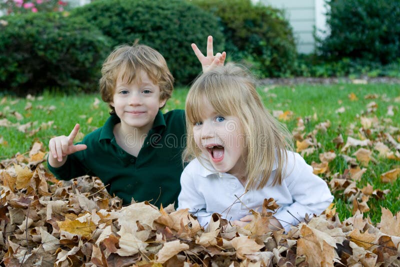 Playing in the autumn leaves