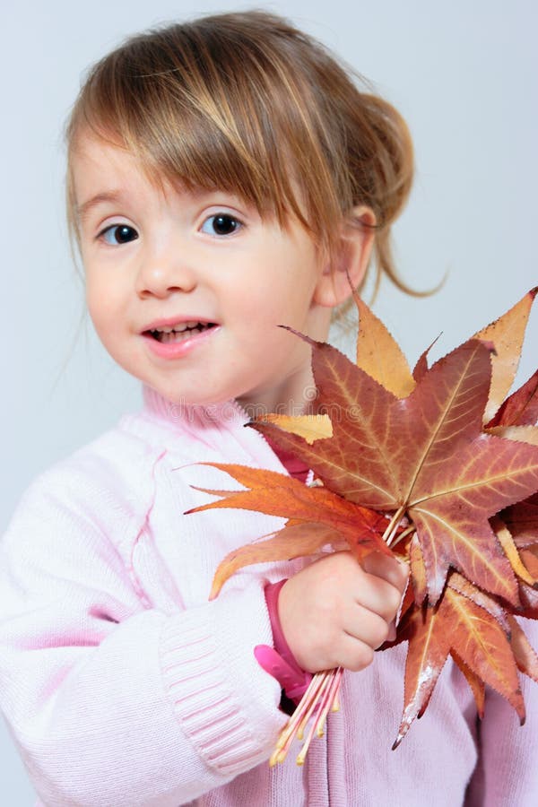 Playing with autumn leaves