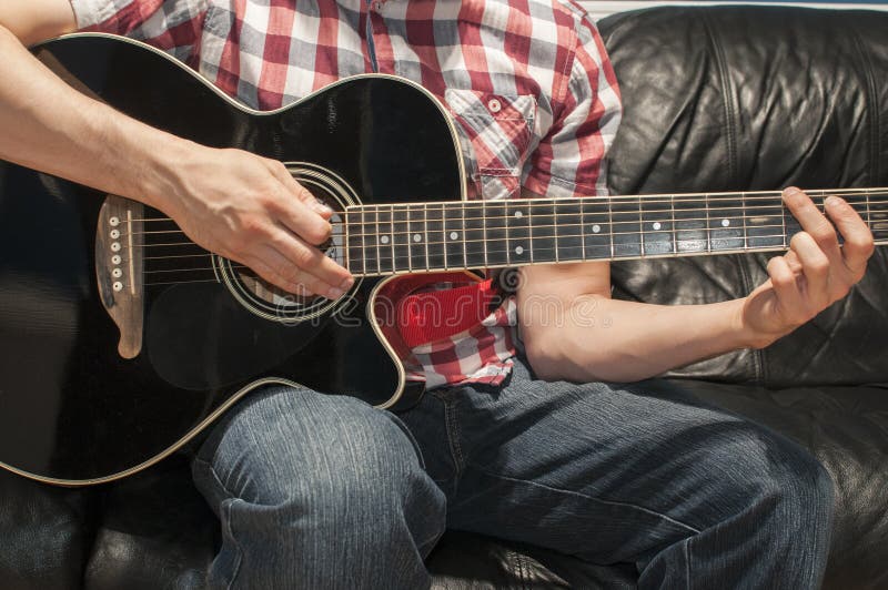 Playing a Black Acoustic Guitar Stock Photo Image of hands