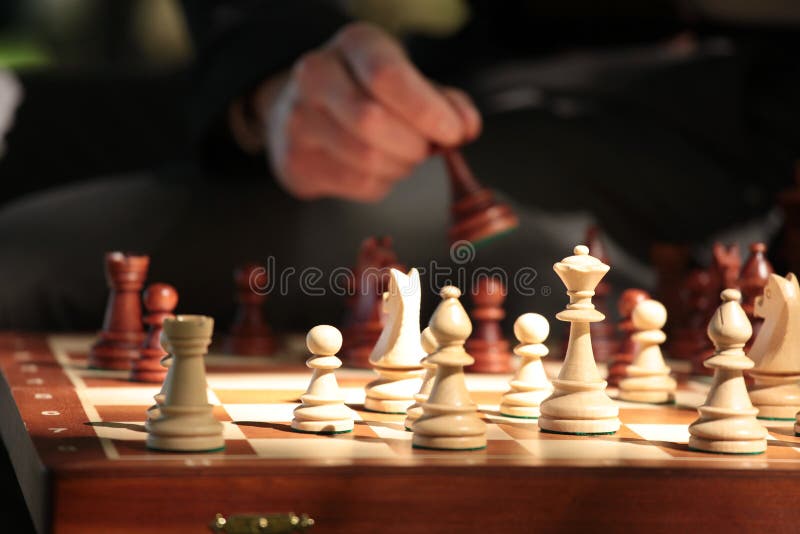 Person Playing Chess Game on Chess Board · Free Stock Photo