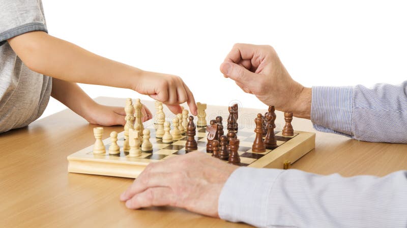 Children's Restraining Hand Thoughtfully Figure Before The Next Chess Move  Stock Photo, Picture and Royalty Free Image. Image 77247675.