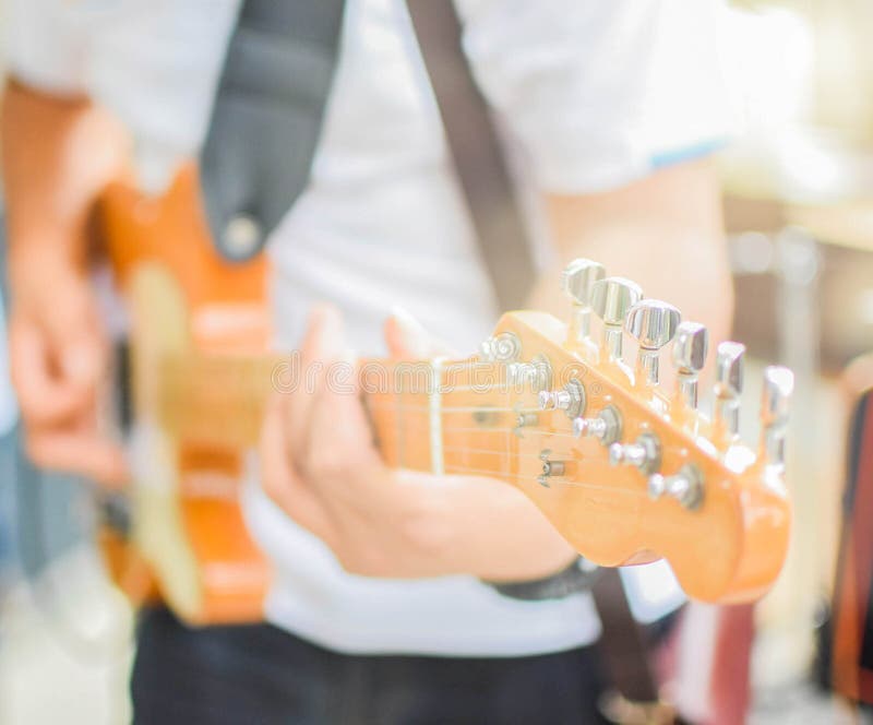 Playing guitar for men stock photography Playing guitar for men stock photography