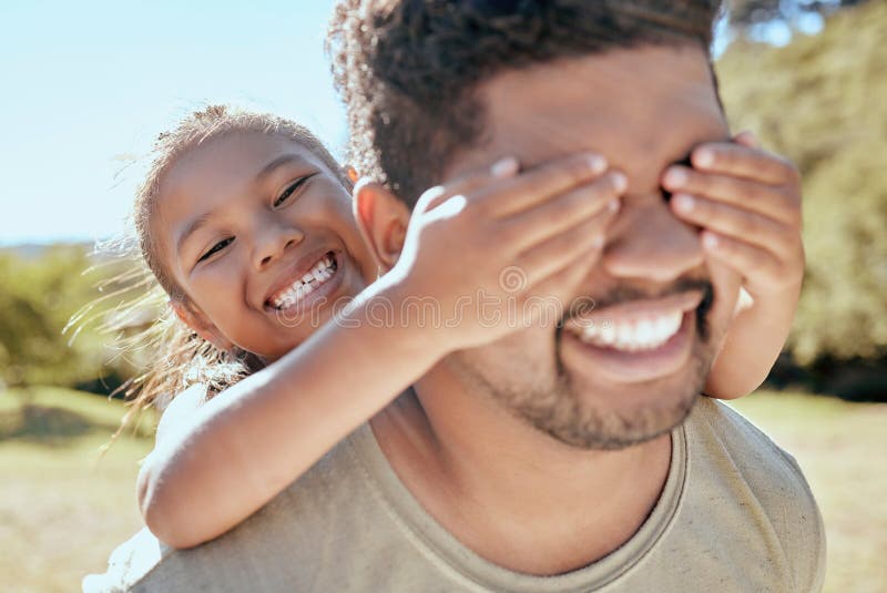 Playing hide and seek, girl and father outdoor together with family love and care in nature. Happy dad and young child having fun quality time in a park with happiness smile bonding and counting.