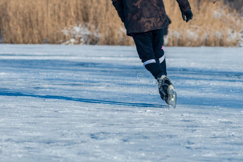 Playing ice street hockey on the frozen lake royalty free stock photo Playing ice street hockey on the frozen lake royalty free stock photo