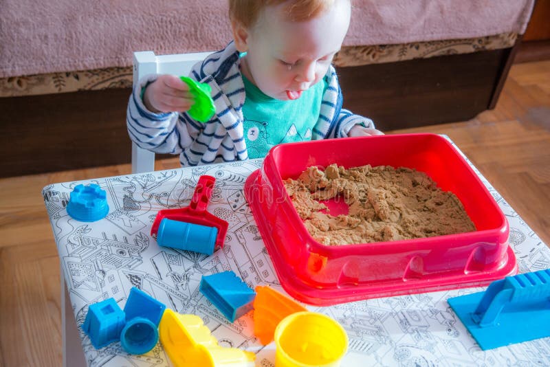 Playing with sand stock photo. Image of child 134288228