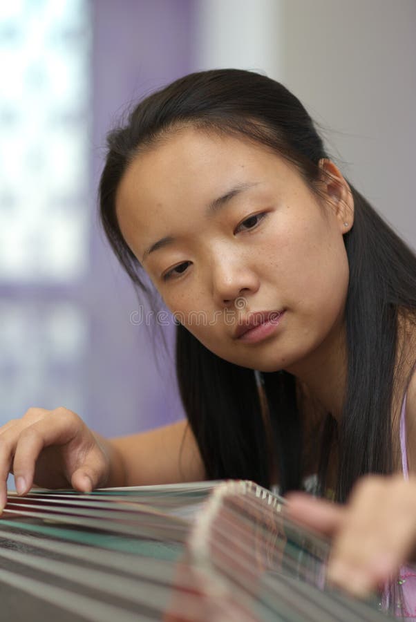 Playing music instrument stock photo. Image of female 16970680