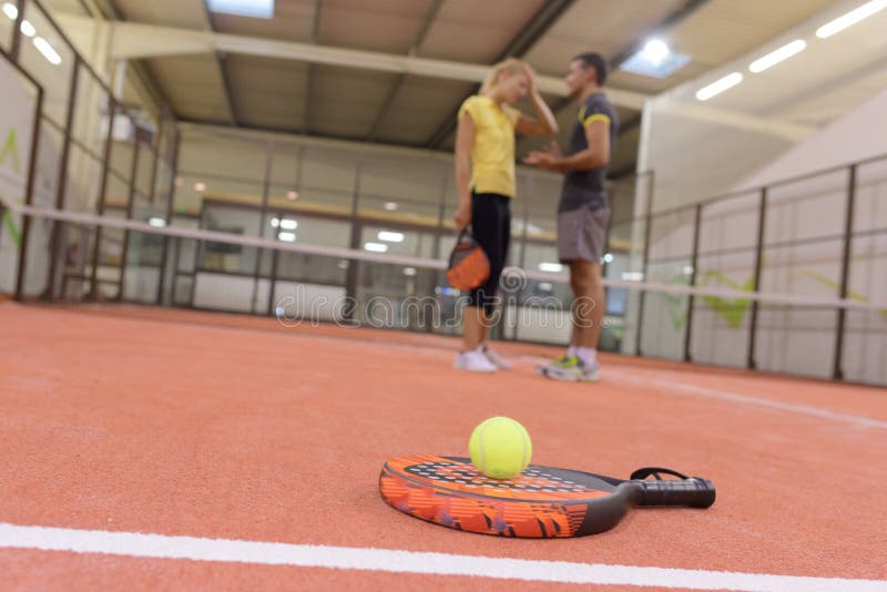 They playing padel indoors royalty free stock images