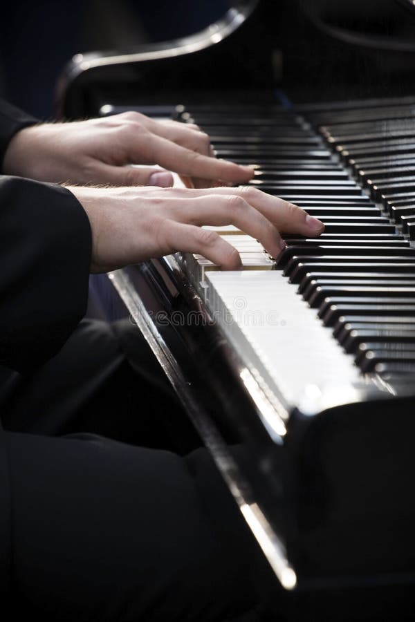Playing piano stock images