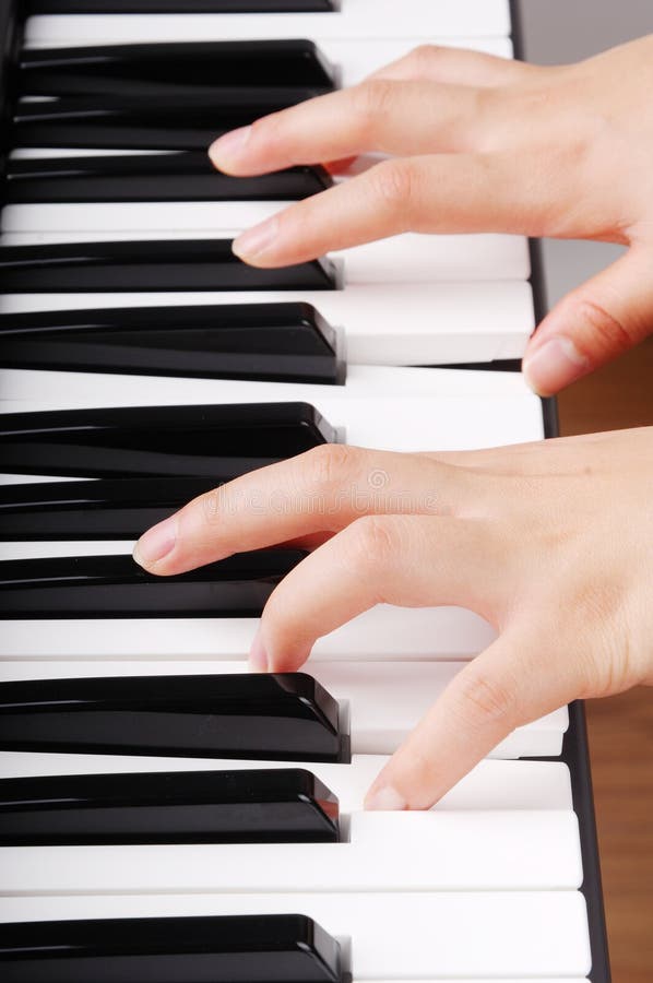 Teenage Boy Sitting on Piano Bench Looking Down Stock Photo Image of