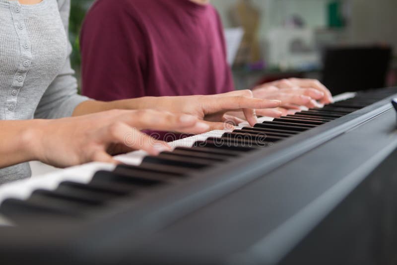 160 Playing Piano Four Hands Stock Photos Free & RoyaltyFree Stock