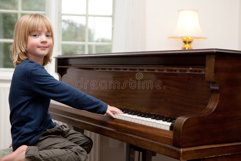 Playing piano music, boy Child instrument
