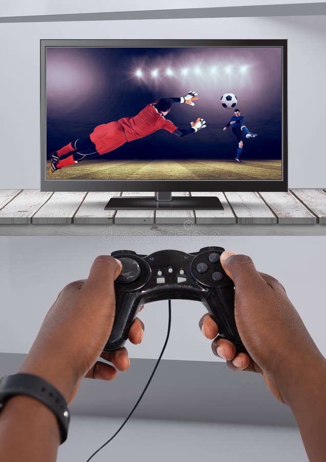 Playing soccer computer game with controller in hands