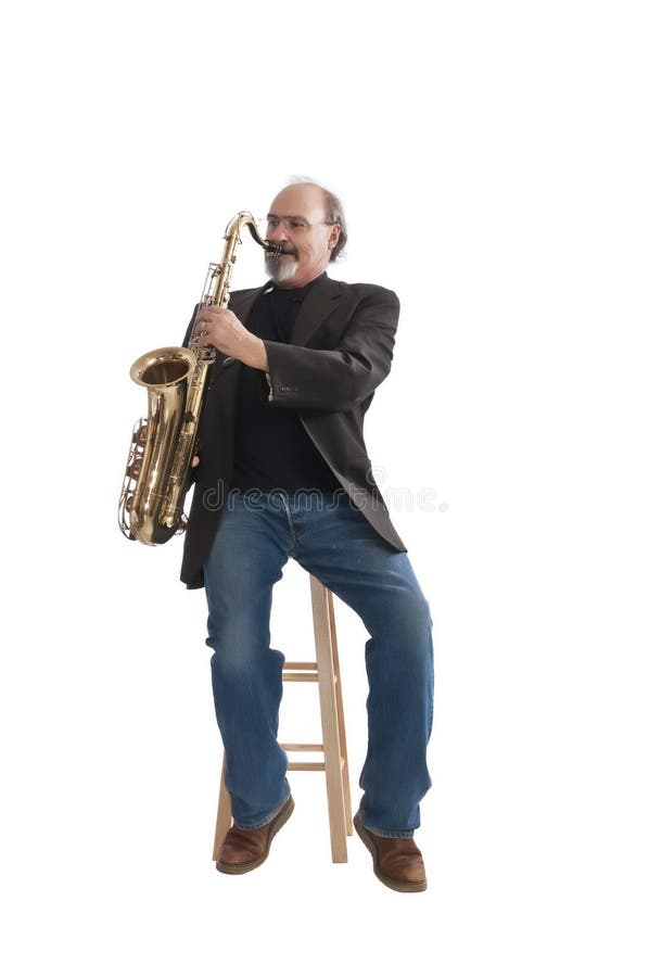 Playing a tenor sax seated on a stool royalty free stock images