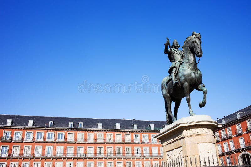 Plaza Mayor in Madrid. Bronze statue of King Philip III constructed in 1616 at the Plaza Mayor in Madrid, Spain, composition with copyspace stock photos Plaza Mayor in Madrid. Bronze statue of King Philip III constructed in 1616 at the Plaza Mayor in Madrid, Spain, composition with copyspace stock photos