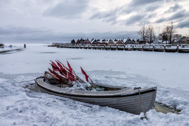 Fishing boat on a lake in winter. Fishing boat on a lake in winter.