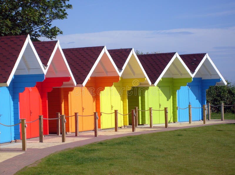 Exteriors of beautiful bright seaside beach chalets, Scarborough, England. Exteriors of beautiful bright seaside beach chalets, Scarborough, England.