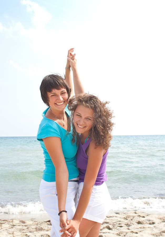 Two happy girls having fun on the beach. Two happy girls having fun on the beach