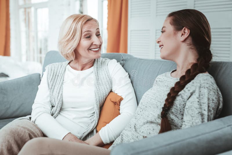Pleasant happy girl having a conversation with her mother royalty free stock photo Pleasant happy girl having a conversation with her mother royalty free stock photo