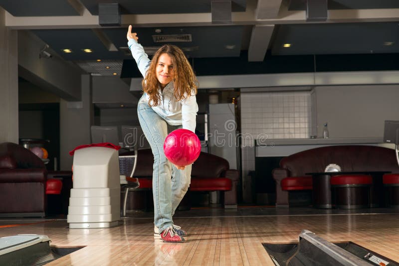 Pleasant Young Woman Throws a Bowling Ball Stock Photo Image of indoors, hand 30924728