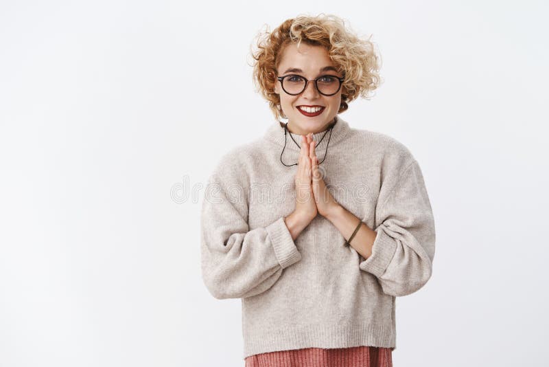 Please I will really appreciate. Portrait of charming cute and friendly attractive female coworker in glasses and stock photo Please I will really appreciate. Portrait of charming cute and friendly attractive female coworker in glasses and stock photo