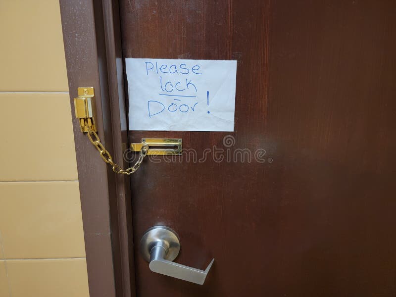 Please Lock Door Note on Bathroom Door with Chain Stock Photo