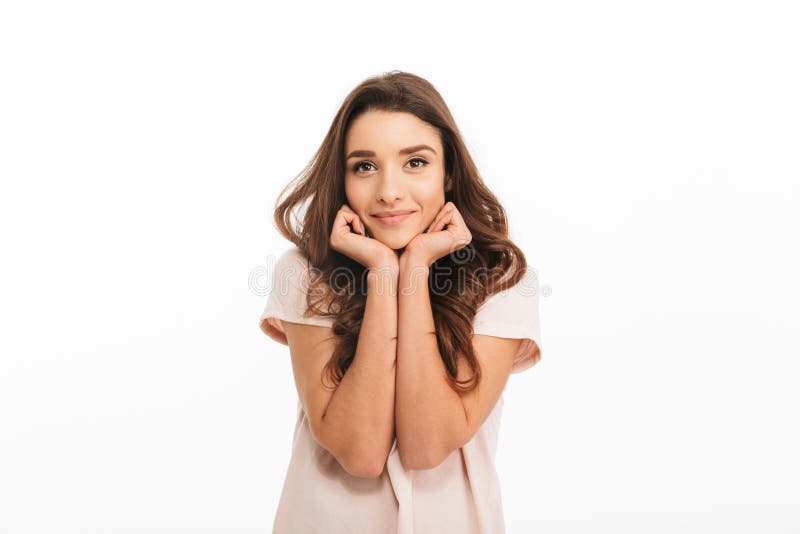 Pleased brunette woman in t-shirt reclines on her hands stock photo Pleased brunette woman in t-shirt reclines on her hands stock photo