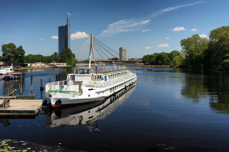 Pleasure river ship against the background of Riga in spring royalty free stock photos