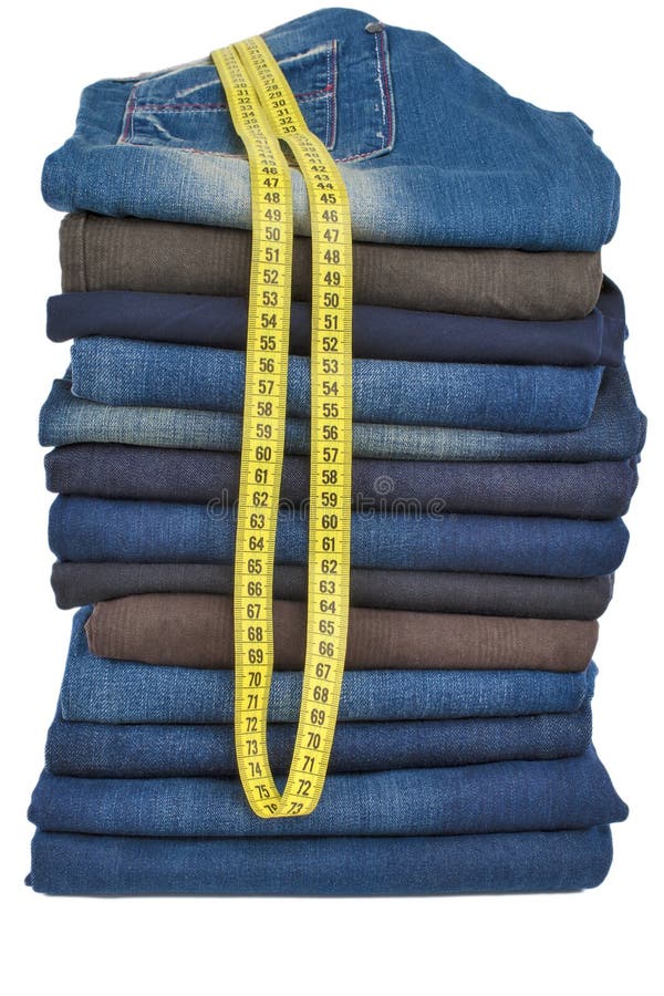 Plenty of male jeans in stack together with tape-line