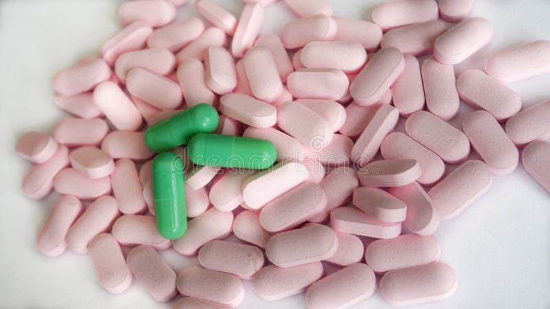 Herbal tablets and capsules for the treatment of stress conditions on a white background stock images