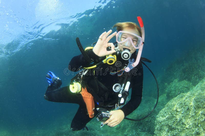 Young woman scuba diver in Mediterranean Sea. Young woman scuba diver in Mediterranean Sea