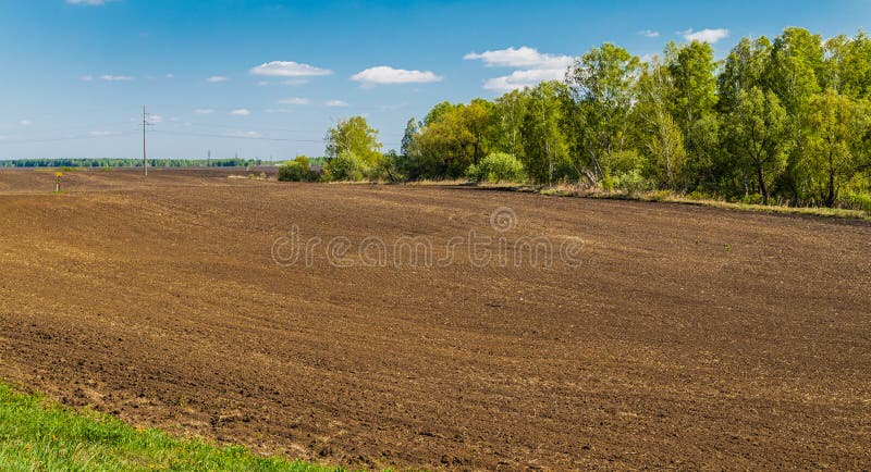 Plowed agricultural field prepared for planting crops in Siberia, Russia royalty free stock photography Plowed agricultural field prepared for planting crops in Siberia, Russia royalty free stock photography