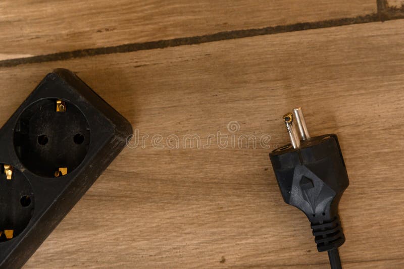 The Plug of the Electrical Appliance after a Short Circuit. the Metal