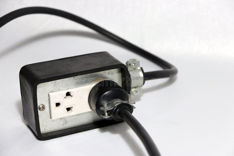 Plug in socket outlet with black cable on the white background. Used for electrical connection. royalty free stock photography Plug in socket outlet with black cable on the white background. Used for electrical connection. royalty free stock photography