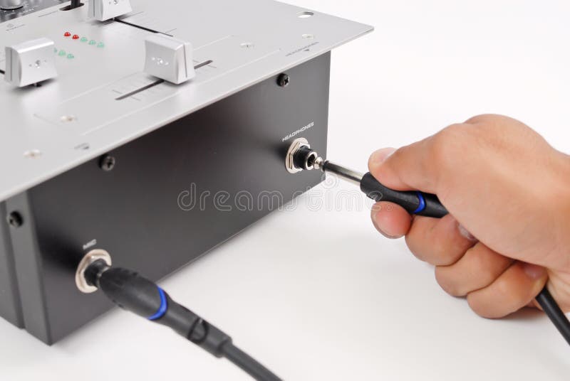 Plugging in the Headphones stock photo. Image of knobs 21280182