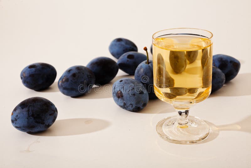 Plum Brandy Or Schnapps With Fresh And Tasty Plum Fruit. Stock Photo