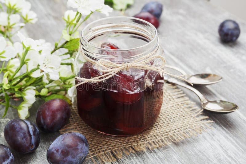 Plum jam in a glass jar stock photo. Image of food, fruit 45135376