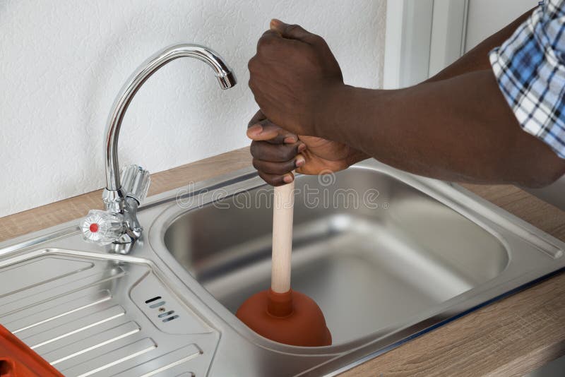 https://thumbs.dreamstime.com/b/plumber-cleaning-sink-plunger-close-up-african-male-57189952.jpg