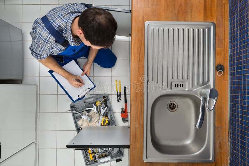 Plumber Examining Kitchen Sink Stock Image Image of fixing, faucet