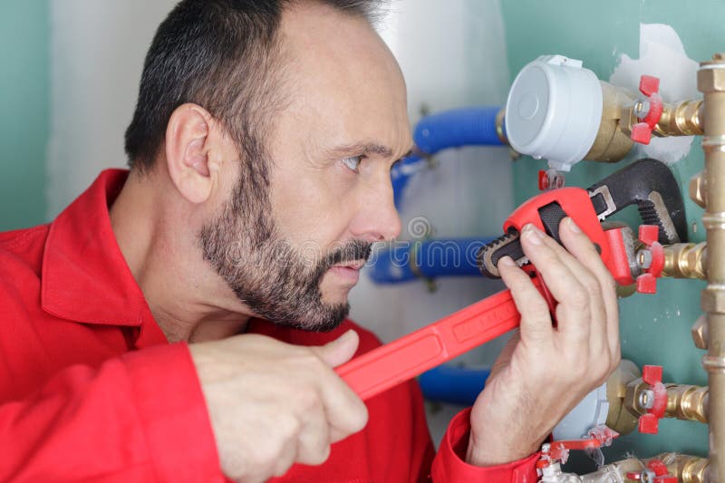 Plumber Man Repairs Water Leak Stock Image - Image of watercloset, plumbing: 310494211