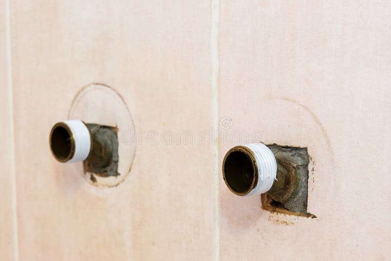 The plumber puts Teflon seam FUM tape on the thread before installing the faucet tap. Close up