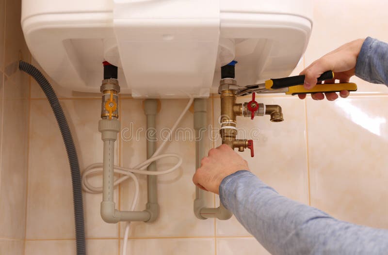 Plumber repairing boiler royalty free stock images Plumber repairing boiler royalty free stock images