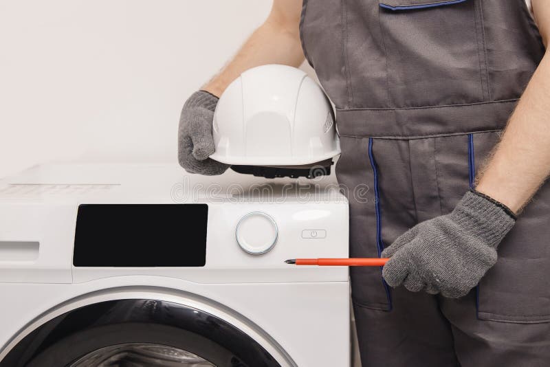 Plumber Repairing Washing Machine, Working Man Fixing Problem Stock