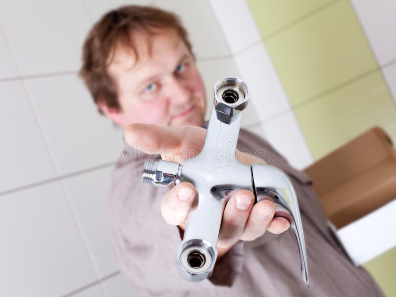 Plumber with a tap stock image. Image of aged, handyman 22677107