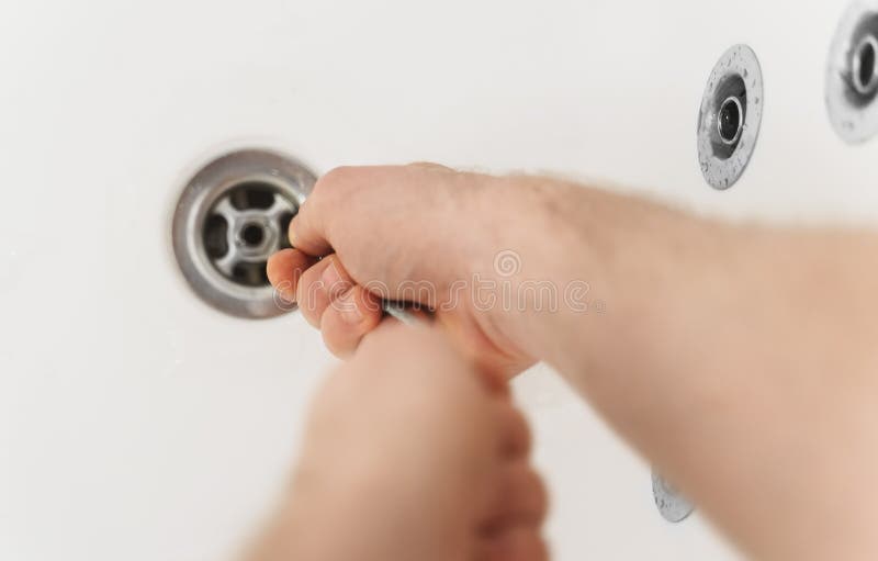 https://thumbs.dreamstime.com/b/plumber-using-drain-snake-plumber-using-drain-snake-to-unclog-bathtub-215948510.jpg