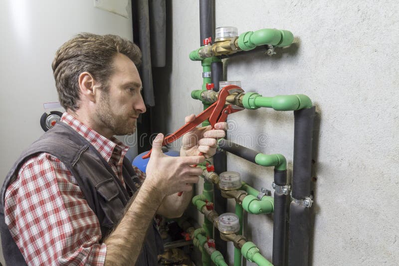 Plumber at Work Installing a Water Meter Stock Image Image of iron