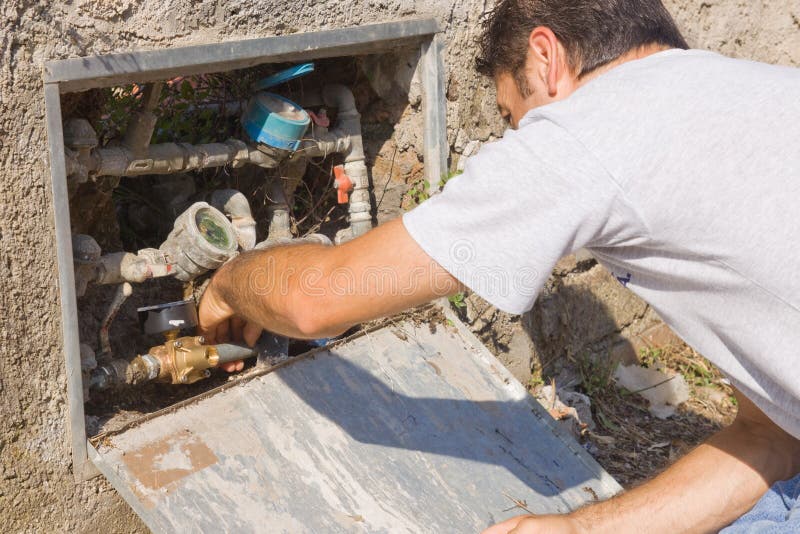 Plumber at work stock image