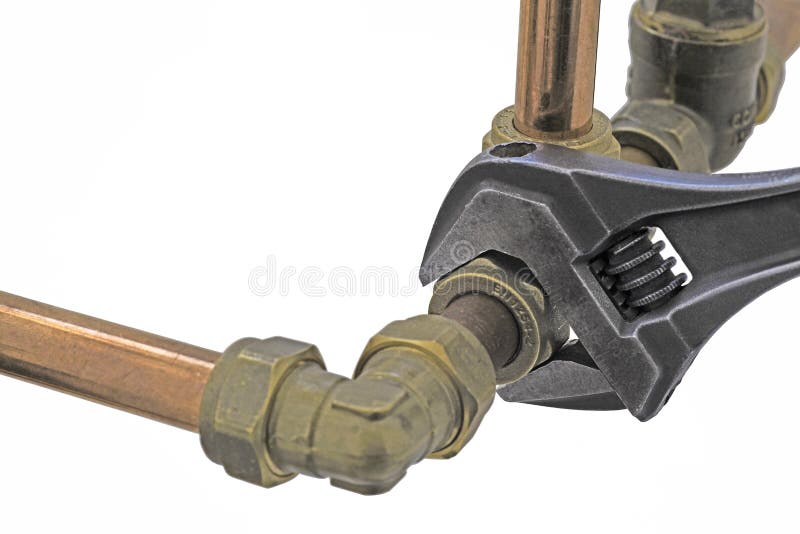 Plumber& x27;s adjustable wrench tightening up copper pipework